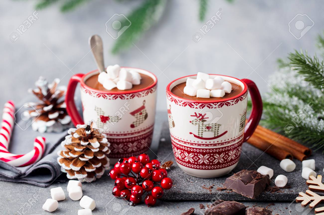 Hot chocolate drink with marshmallows. Christmas, New Year decoration. Grey background. Close up. Copy space